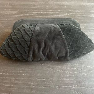 Black suede Lauren Merkin clutch with petal detail